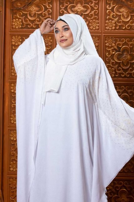 Luxurious White Abaya – Embroidery & Stone Work is an elegant and sophisticated modest wear piece. Crafted in pure white, this abaya features intricate embroidery and stone embellishments, giving it a refined and graceful appearance. Perfect for special occasions, Islamic gatherings, and festive events, it blends modesty, elegance, and premium craftsmanship.