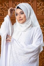 Luxurious White Abaya – Embroidery & Stone Work is an elegant and sophisticated modest wear piece. Crafted in pure white, this abaya features intricate embroidery and stone embellishments, giving it a refined and graceful appearance. Perfect for special occasions, Islamic gatherings, and festive events, it blends modesty, elegance, and premium craftsmanship.
