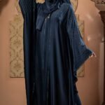 Dark Blue Color Abaya – Stone Work is a stylish and elegant modest wear piece designed for a graceful look. Crafted in rich dark blue, this abaya features delicate stone embellishments that add a touch of sophistication and shine. Perfect for daily wear, Islamic gatherings, and special occasions, it blends modesty, comfort, and modern elegance image