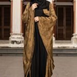 Olive & Black Color Abaya – Stone Work is a stylish and elegant modest wear piece. Designed in a classy olive and black color combination, this abaya features intricate stone embellishments that enhance its sophistication. Perfect for daily wear, Islamic gatherings, and special occasions, it blends modesty, modern style, and refined craftsmanship. image