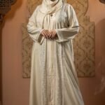 Cream Color Borka – Lace & Stone Work is a graceful and elegant modest wear piece. Designed in soft cream color, this borka features delicate lace detailing and stone embellishments that add a refined and sophisticated touch. Perfect for daily wear, Islamic gatherings, and special occasions while maintaining modesty and comfort image