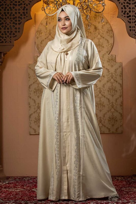 Cream Color Borka – Lace & Stone Work is a graceful and elegant modest wear piece. Designed in soft cream color, this borka features delicate lace detailing and stone embellishments that add a refined and sophisticated touch. Perfect for daily wear, Islamic gatherings, and special occasions while maintaining modesty and comfort image